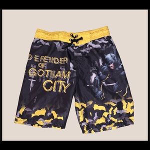 Boys  “dark night” Batman swim trunks.